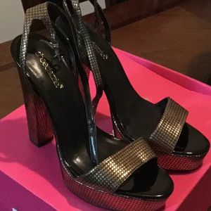 Gold and black heels